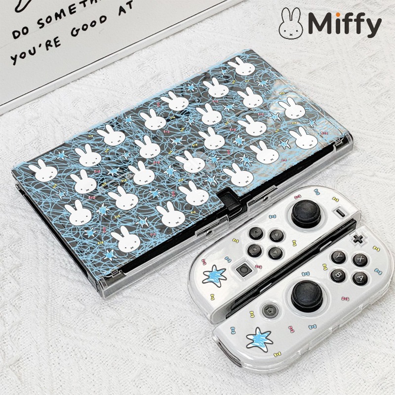Gaming Console In - ニンテンドースイッチOLED用、かわいいミッフィー柄のコンソールケース。分割式ハードシェルで、落下防止機能付きの保護カバー。ゲーム機本体を保護します。